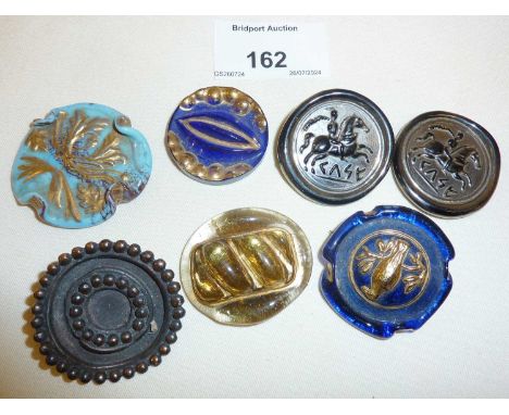 Seven interesting pressed Art glass discs, some as brooches or buttons. Two marked as from Bimini/Orplid Glassworks, c. 1950'