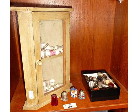 Good collection of vintage ceramic, glass and metal thimbles with miniature shelving display unit