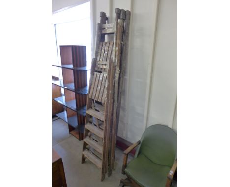 Two sets of stepladders and an extending ladder