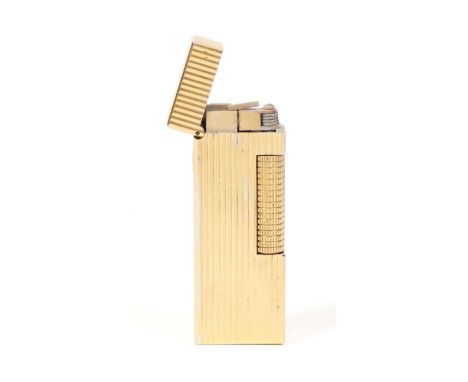 A Dunhill rollagas pocket lighter, gold plated with ribbed design, with box (damaged)