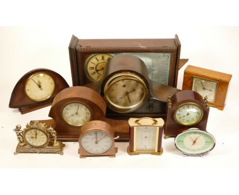 A collection of mid 20th century and later mantel clocks, having manual and quartz movements in two boxes. (2)