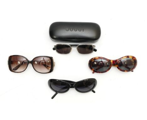 Four pairs of designer sunglasses, comprising of three pairs of Gucci sunglasses, to include, a pair of oval tortoiseshell fr