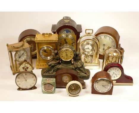 A collection of mid 20th century and later mantel clocks, having manual and quartz movements in two boxes. (2)
