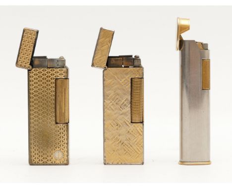 Alfred Dunhill; A Dunhill G2 dress lighter, two tone silver and gold case, together with two Dunhill rollagas lighters, gold 