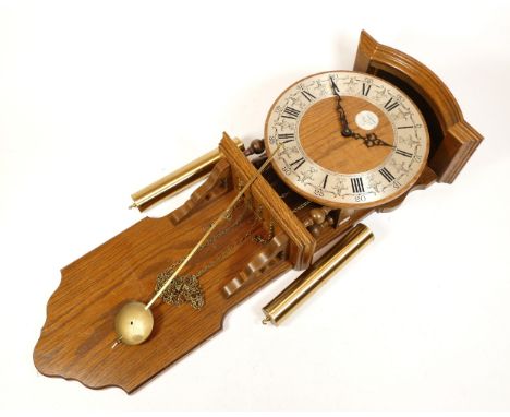 A mid-twentieth century oak Dutch wall clock with a silvered chapter dial, bearing the name Tempus Fugit, and with a two trai