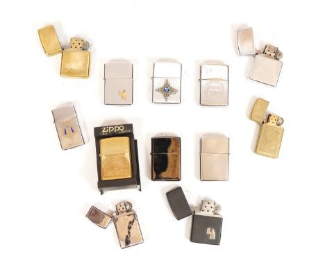 A collection of twelve Zippo cigarette lighters, petrol operated to include brass, chrome, and brushed stainless examples.