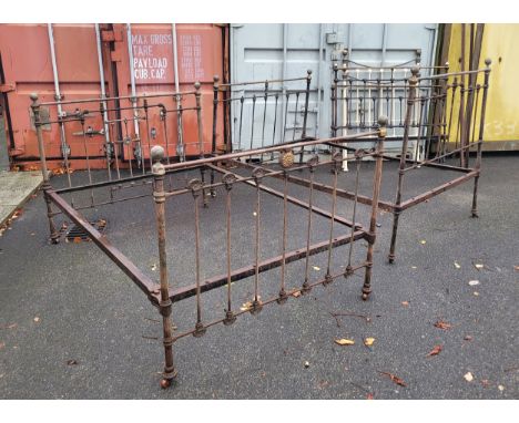 Three Edwardian brass bedsteads, size double 4'6ins, together with a later painted brass single bedstead (lacking side irons)