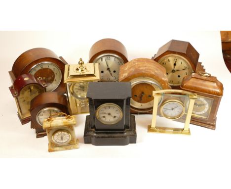 A collection of mid 20th century and later mantel clocks, having manual and quartz movements in two boxes. (2)