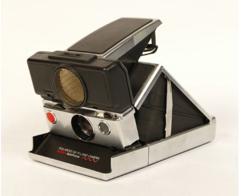 A Polaroid SX70 Sonar AF SLR camera, stainless steel with black covering. Boxed with instructions