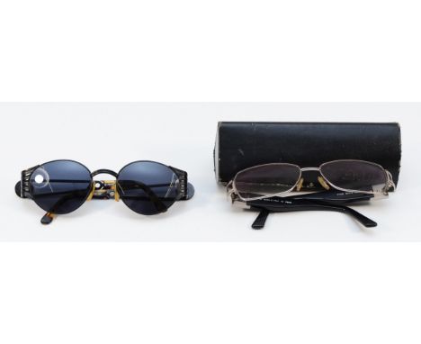 Two pairs of Fendi glasses, to include, a pair of round sunglasses with tortoiseshell arms, FS 299 and a pair of reading glas