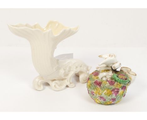 A Belleek cornucopia vase, in white, together with a Staffordshire Pottery quill holder, in the form of a birds nest, the tex