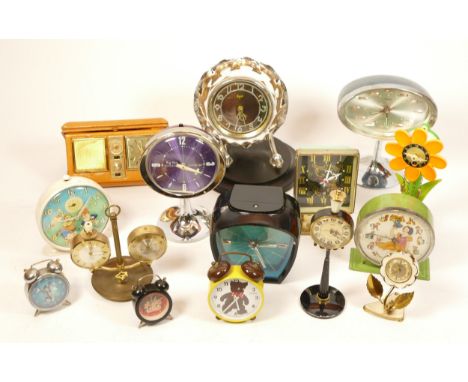 A collection of 1950s/60s clocks, to include novelty bedside alarm clocks, all manual wind movements.