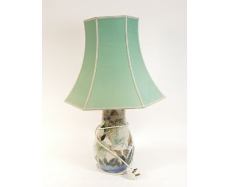 Michael Mosse (1951-); An electric ceramic table lamp, depicting two medieval horseriders, complete with plug and seafoam gre