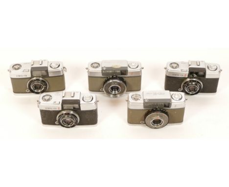 Five Olympus Pen half frame cameras. Four Pen-S, one original model, second version