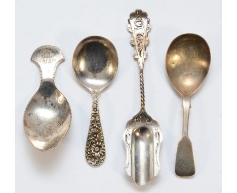 An American cast silver caddy spoon, Kirk &amp; Son, a Dutch silver caddy spoon and two English silver caddy spoons,67gm