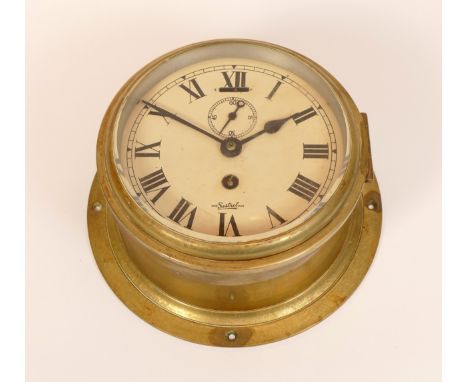 A mid 20th century English brass bulkhead clock by Sestrel, having painted dial with subsidiary seconds dial, 14cm dial diame