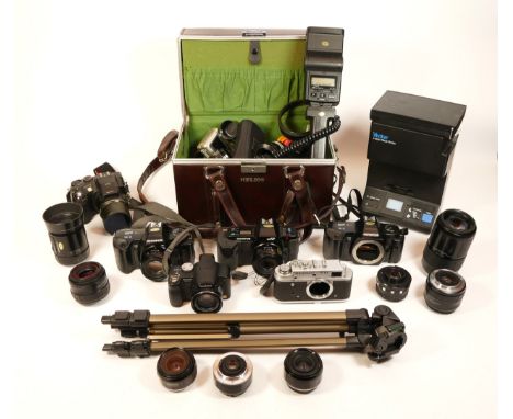 A collection of cameras, including Olympus OM101 x2 with several lenses, Fujifilm S7000, Panasonic Lumix DMC-FZ28