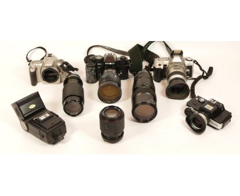 A collection of cameras, including Minolta AF9000 with 28-135 lens, Minolta Dynax 505Si with lens, Nikon F55, Minolta 110 SLR