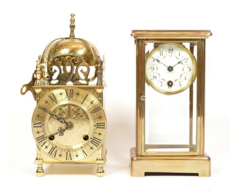 A mid 20th century brass lantern clock, having German 8 day movement, striking on bell, 24cm tall, together with an early bra