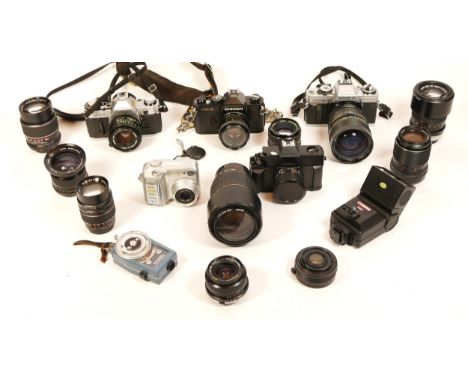 A Collection of Cameras, including Canon A-1 with 590mm lens, a Minolta XG-M, a Tamron Di 70-300mm in Sony Alpha / Minolta AF