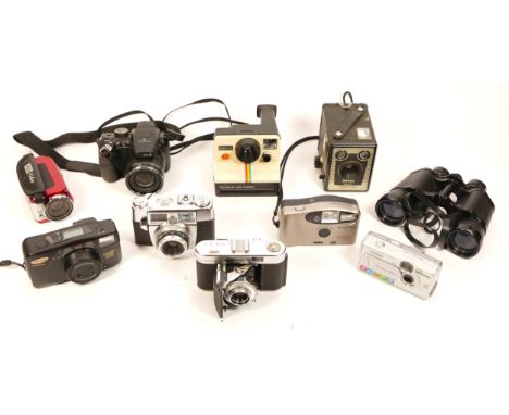 Cameras, including a Fujifilm Finepix S-4500, a Voigtlander Vito II folding 35mm camera, a Samsung 1150 zoom