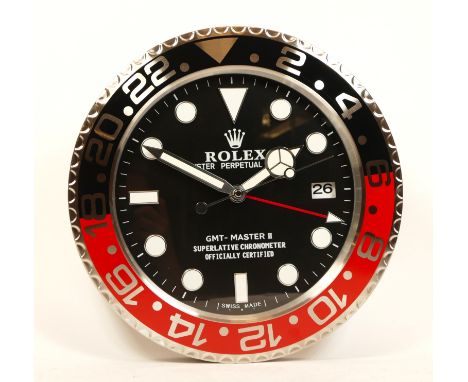 A 'Rolex' style advertising wall clock, black dial reads 'Rolex Oyster Perpetual Date GMT-Master II', having quartz movement,