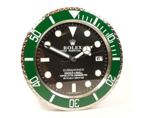 A 'Rolex' style advertising wall clock, black dial reads 'Rolex Oyster Perpetual Submariner' having quartz movement, 34cm dia