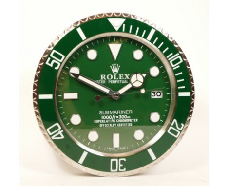 A 'Rolex' style advertising wall clock, green dial reads 'Rolex Oyster Perpetual Submariner' having quartz movement, 34cm dia