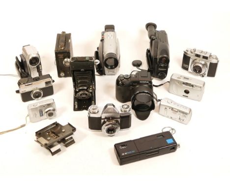 Cameras, including Balda, Contaflex, Olympus C-8080, a JVC Mini DV Camcorder, a Coronet 9.5mm movie camera