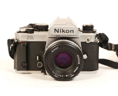 A Nikon FA camera, in chrome finish, with 50mm f/1.8 Nikon Ais Pancake lens, cap, strap