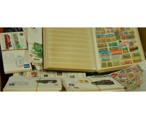 A large quantity of 20th century British and world stamps and first day covers both in albums and loose.