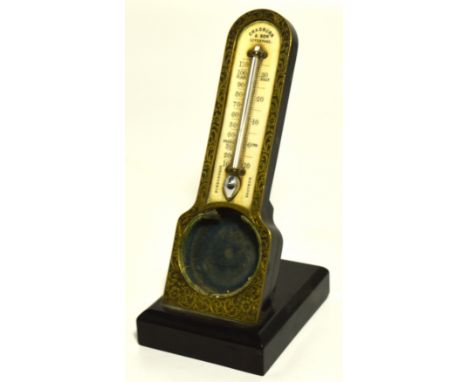 An unusual late 19th century ebonised and engraved brass pocket watch holder/thermometer, the arched ivory dial inscribed "Ch