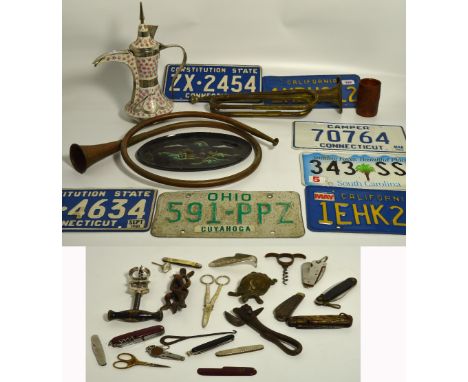 A small quantity of collectors' items to include reproduction American number plates, a bugle, pocket knives etc, also three 