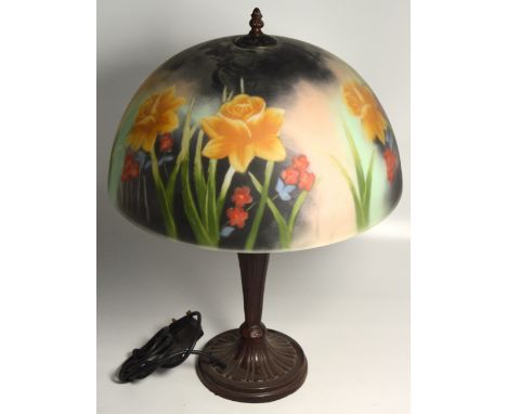 An Art Deco style lamp, the metal base supporting a mushroom shaped glass shade with floral decoration, height 56cm.