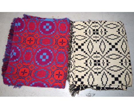 Two vintage 100% Welsh wool tapestry throws, with geometric design in blues, reds, purples and one in a palette of ivory, whi