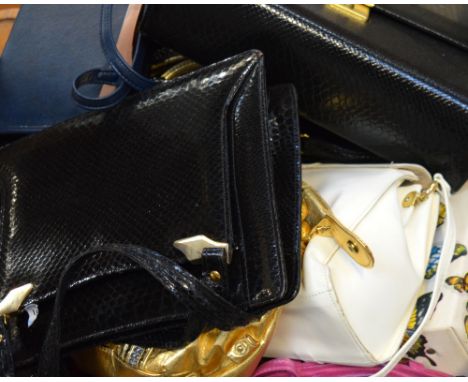 A box of vintage bags to include leather handbags and evening bags.