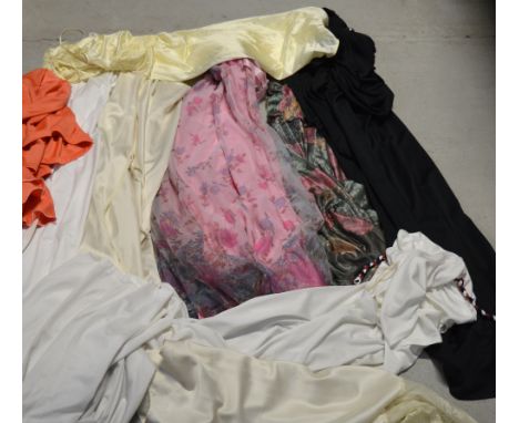 A small quantity of vintage clothes to include a pink floral nightdress, ivory/black halter neck dresses, a ruched dress with