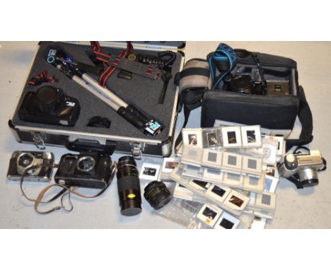 A quantity of cameras, lenses and camcorders to include a Tamashi camera with a 15mm colour lens presented in a hard case wit