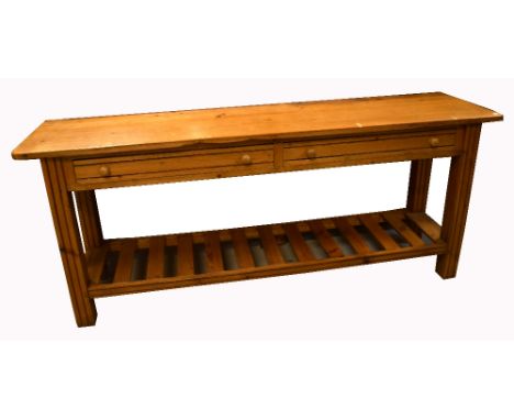 A pine dresser base, with two long drawers over lower slat shelf, 75 x 184cm.