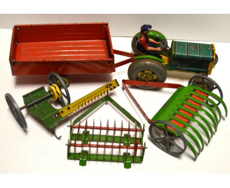 A group of mid 20th century pressed steel farm vehicles by Mettoy to include tractor with driver figure, trailer, harrow, tru