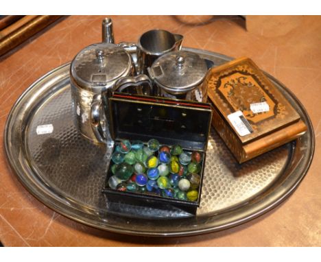 A mixed lot of collectors' items comprising vintage marbles, a musical box, a stainless steel tea service, a farthing penknif