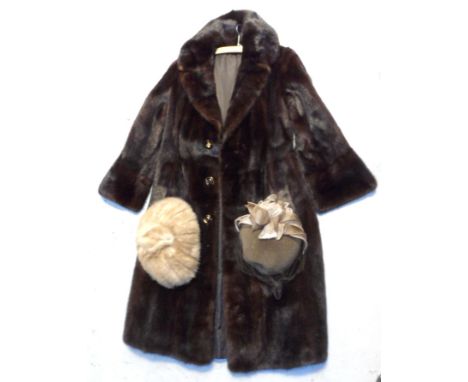 A vintage c.1970s musquash chocolate brown fur coat, a beige mink hat and a vintage hat with veil and flower trim (3).