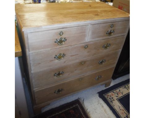 A Victorian pine chest of two short above three long drawers raised on bracket feet