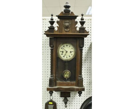 A 20th Century walnut cased Vienna type regulator wall clock, the eight day movement with circular paper dial bearing Turkish
