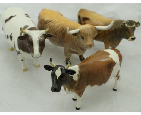 A collection of four Beswick cattle figures including "Ayrshire Bull CH Whitehill Mandate", "Ayrshire Cow CH Ickham Bessie", 