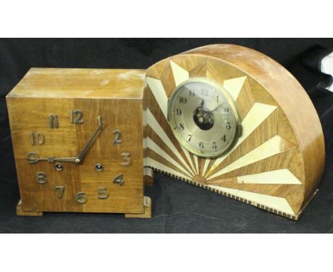 A 1930's Art Deco dome top mantle clock with simulated ivory inlaid starburst decoration, the German movement, inscribed "Mod