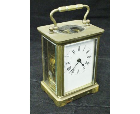 A brass cased carriage clock, the case stamped "S W Hoyland"