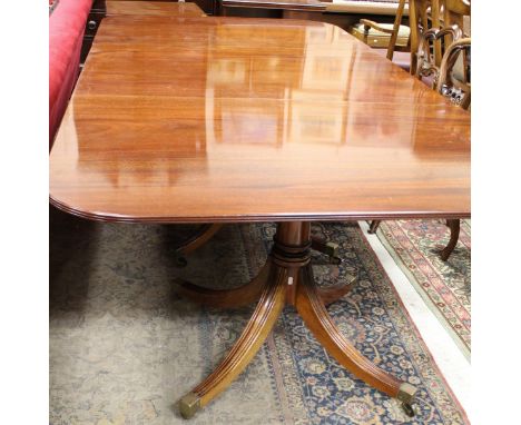 A modern mahogany triple pillar extending dining table in the Georgian style by William Tillman(bears label to underside of e