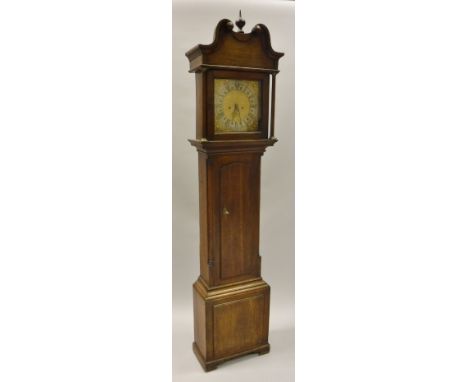 An 18th Century oak cased long case clock, the eight day movement with square brass dial and silvered chapter ring with Roman