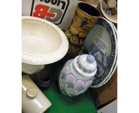 A pair of modern Delft chargers by Royal Sphinx of Maastricht, decorated with rural designs after J Sonneville, a Poole Potte